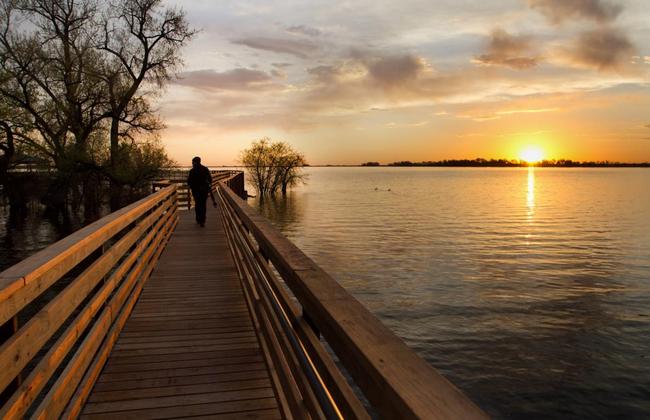 photograph of walkway to gazebo at Barr Lake State Park during sunrise
